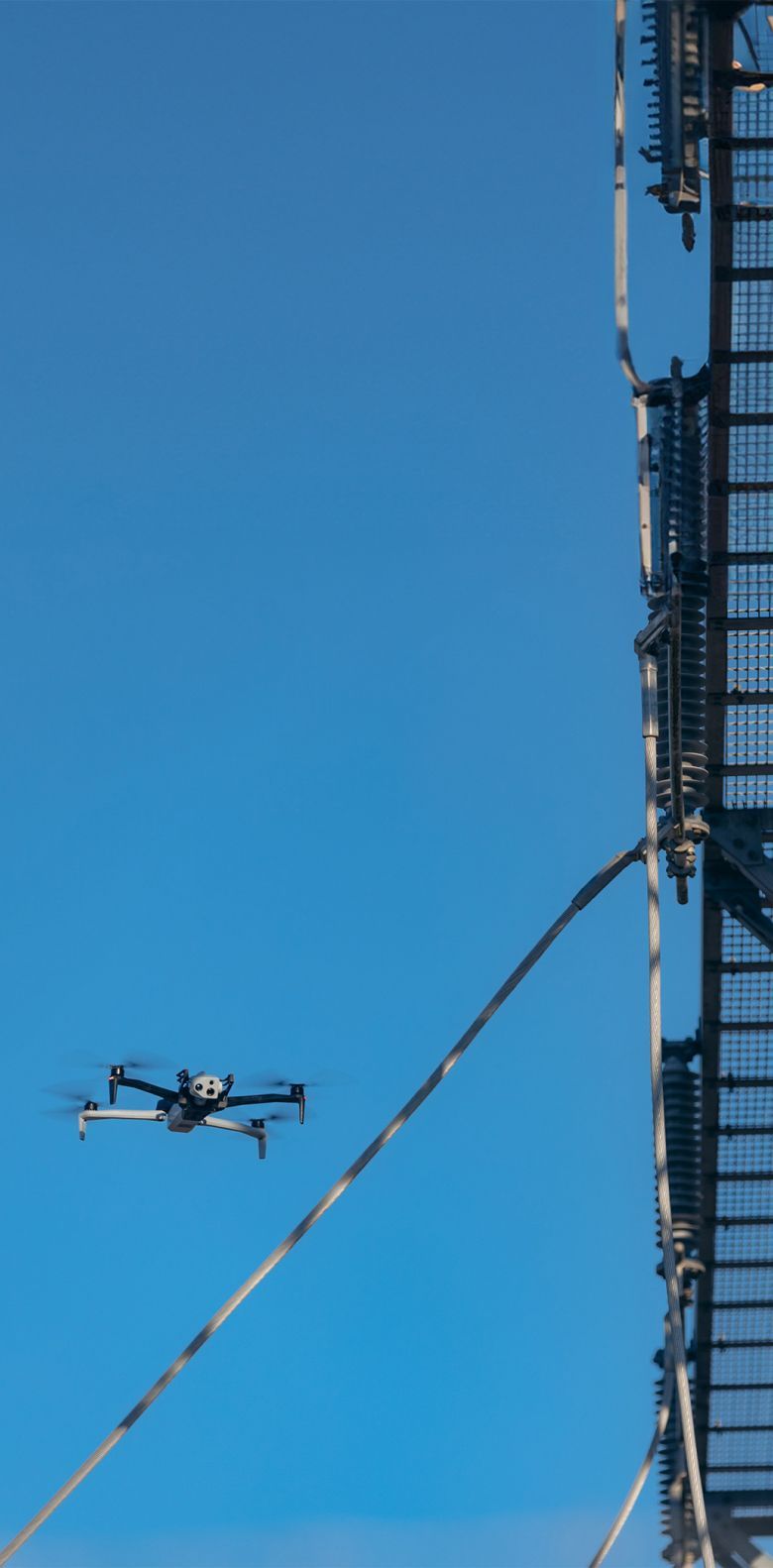 image of Skydio drone flying near electrical utility assets
