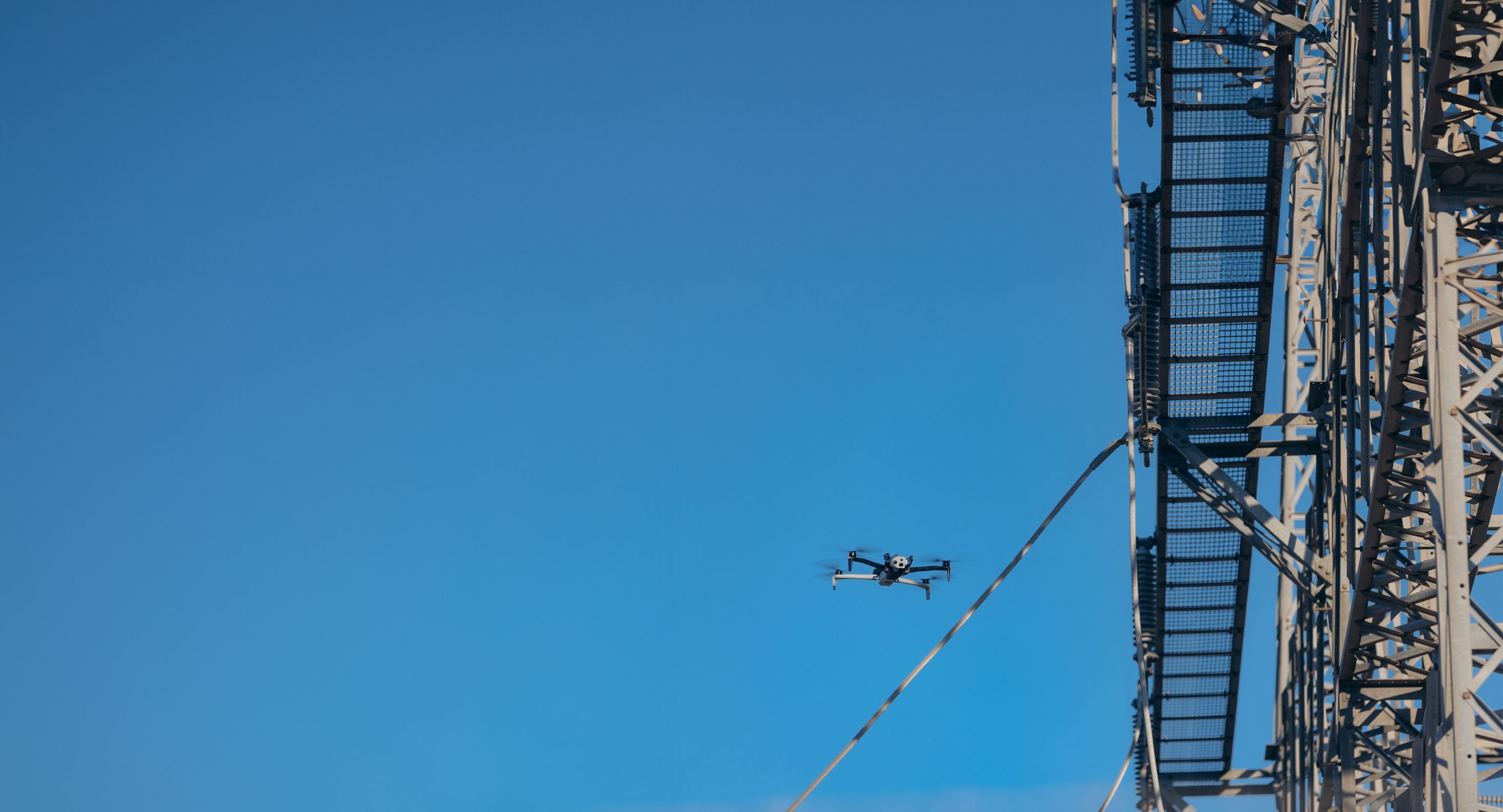 image of Skydio drone flying near electrical utility assets