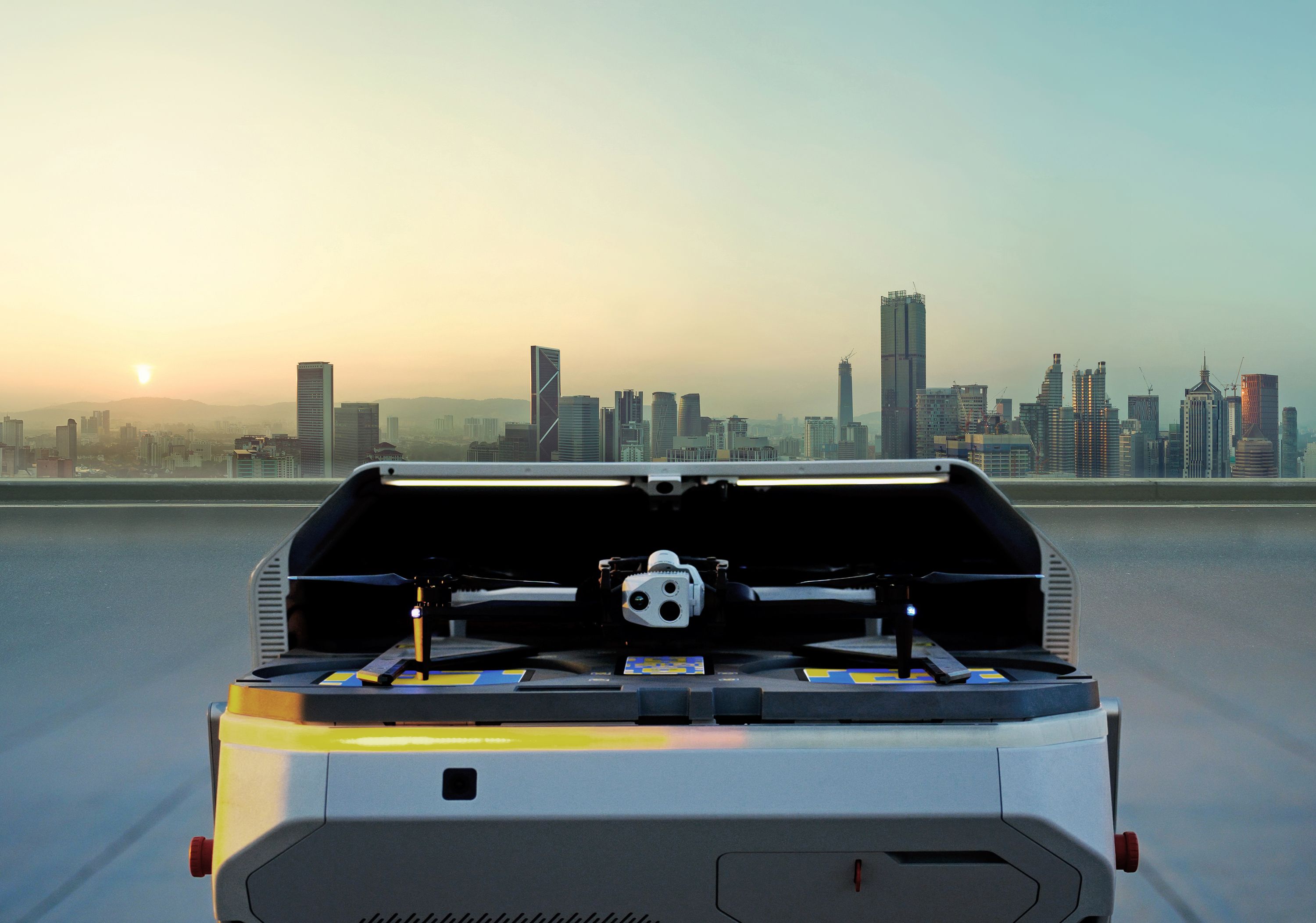 open Skydio Dock for X10 with Skydio X10 drone on a rooftop in a city setting