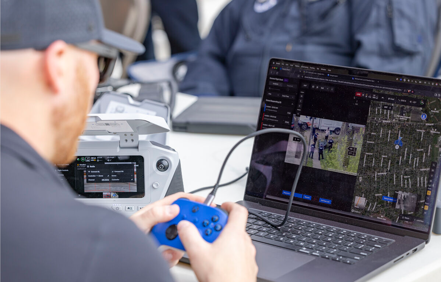 Rescue drone pilot flying a Skydio drone to respond to emergency situation