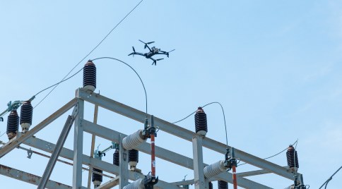 a Skydio X10 drone over power lines