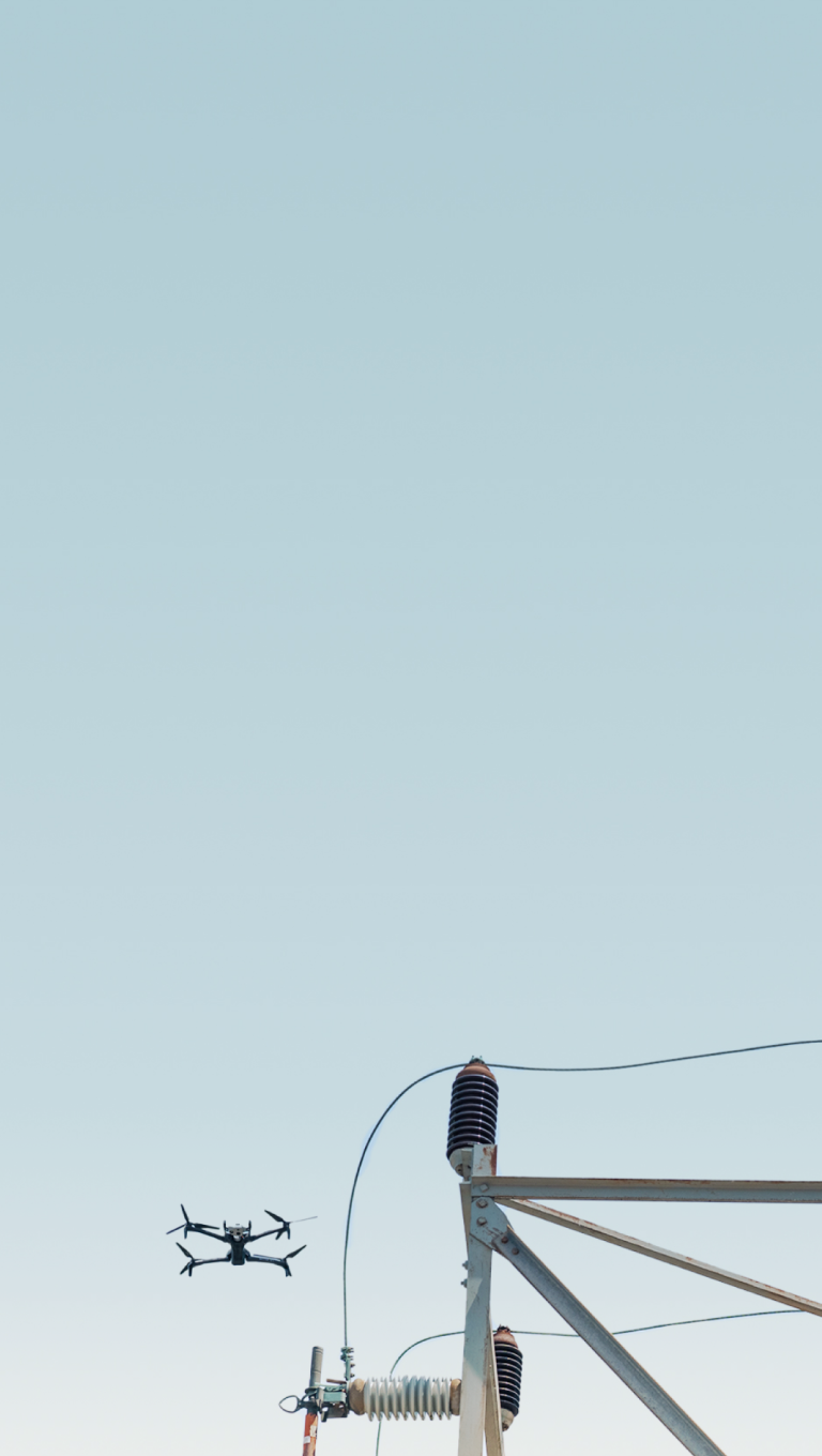 Skydio X10 flying near utility infrastructure