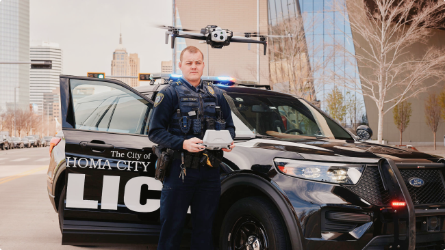 Police officer operating a Skydio X10 Drone to respond to incident